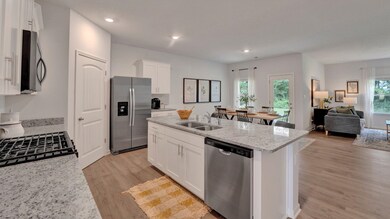 Kitchen featuring a wealth of natural light, appli