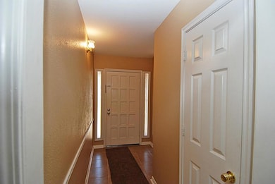 ENTRY WITH TILE FLOORING ... 6 PANEL DOORS ARE AN