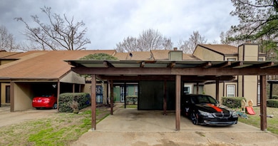 View of property with a carport