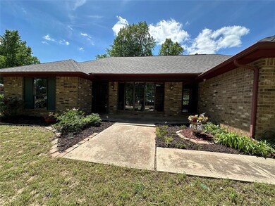 Large covered front porch and landscaping