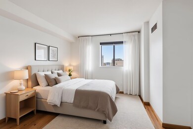 Virtually staged bedroom where robots dream of electric sheep.