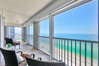 Sunroom / solarium with a view of the beach and a 