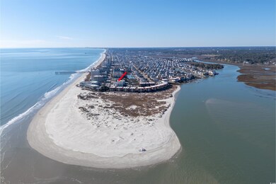 Birds eye view of property with a beach view and a