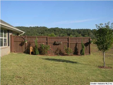 This beautiful fence line adds warmth and privacy 