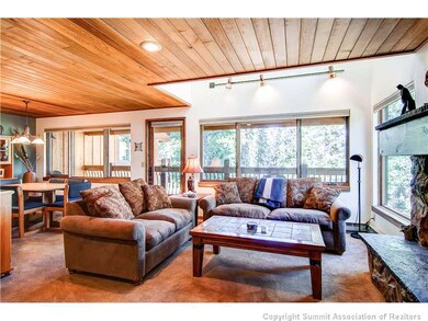 Living Room. paneled ceiling continues to dining a