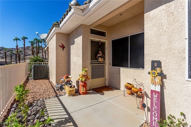 Doorway to property with stucco siding and a patio area