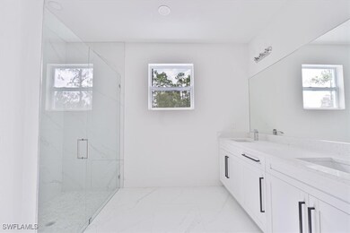 Bathroom with marble finish floors, healthy amount