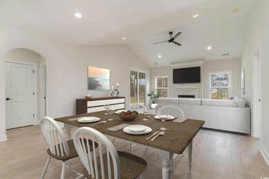 Dining space with visible vents, a ceiling fan, ar
