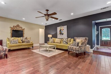 Open Living Area with Wood Flooring will Invite you Home