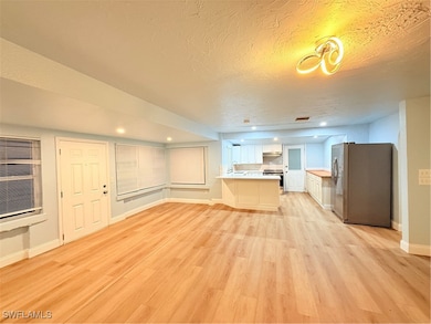 Unfurnished living room with light wood-type floor