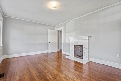 Decorative fire place and mantle to center the roo