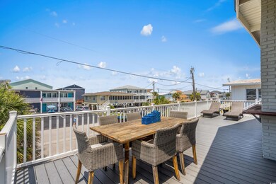 Wooden terrace with a residential view and outdoor dining space