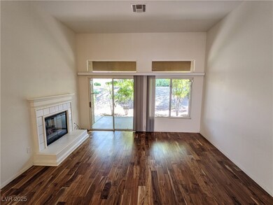 Unfurnished living room with dark wood-style floor