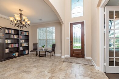 Natural light, high ceilings and neutral ceramic tile showcase entrance.