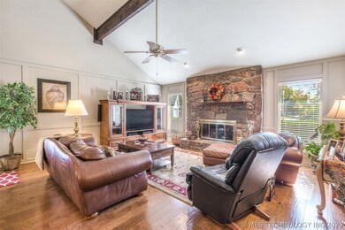 Bright, vaulted Living Room features engineered ha