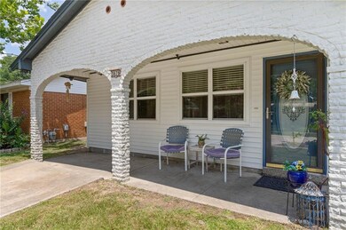 Front porch with lovely archways above to greet yo