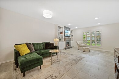 Mock fireplace with built ins and tv area.