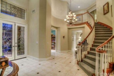 Grand Entrance.  Sweeping Staircase.