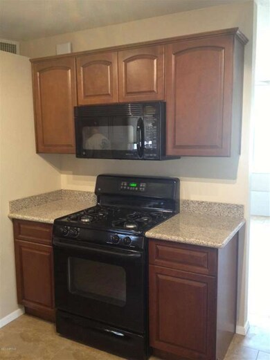 kitchen with granite and gas range