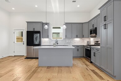 Gourmet kitchen equipped with stainless steel appl
