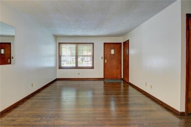 Living room another view. Lovely hardwoods