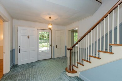 Double coat closets frame the front door