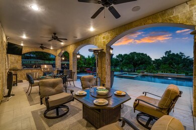 Outdoor living area with grill and golf cart garag