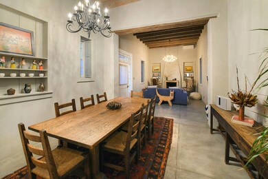 Dining rm with high beamed ceilings