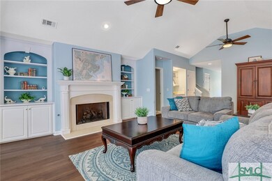 Custom cabinets and shelving. Cozy fireplace with