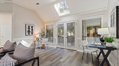Interior space featuring lofted ceiling with skyli