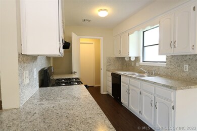 Kitchen is light and bright with lots of counters