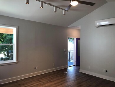 Empty room featuring ceiling fan, baseboards, vau