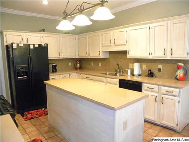 Kitchen with island and MANY cabinets