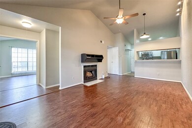 Living and dining area with vaulted ceiling