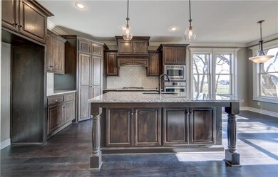 Designer chefs kitchen includes black silgranite o