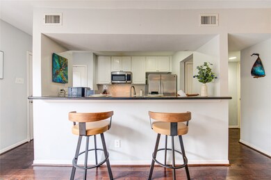 Kitchen area opens on two sides with an expansion