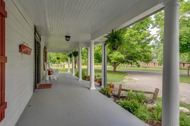 Come sit a spell.....amazing  wrap around covered porch! 