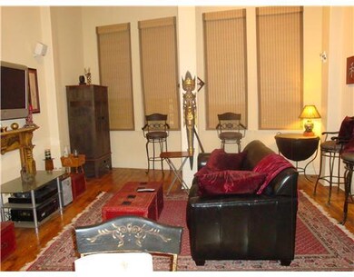Living Room. ORIGINAL WOOD FLOORS.  CUSTOM WINDOW