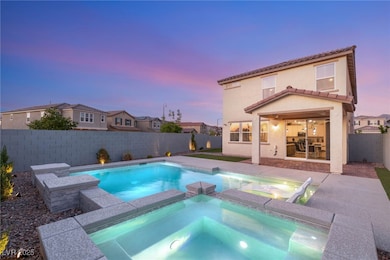 Pool at dusk with a fenced backyard, a patio area,