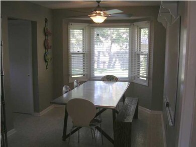 Dining Room w/ Ceiling Fan + Great View of Back Ya