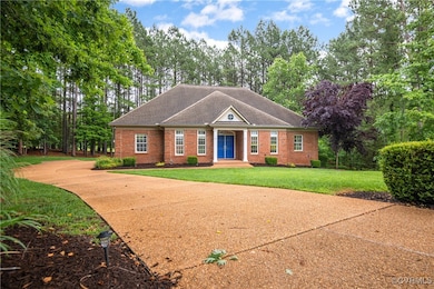 View of front of property with brick siding, a fro