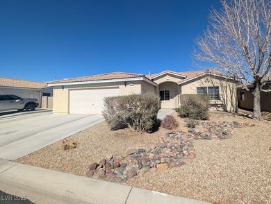 Ranch-style home with driveway, an attached garage