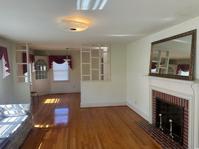Unfurnished living room with hardwood / wood-style floors and a fireplace