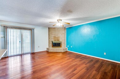 Unfurnished den  featuring wood finished floors, a