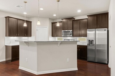 Kitchen featuring stainless steel appliances, dar