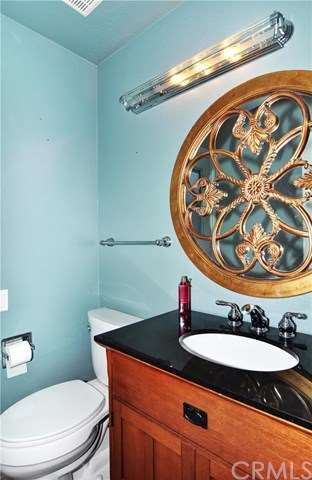 The downstairs powder room is nicely updated with 