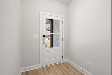 Doorway featuring plenty of natural light and wood