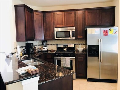 Kitchen featuring decorative backsplash, a sink, 