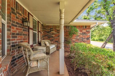 Enjoy a cup of coffee on this amazing front porch!