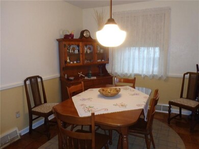 Dining area with parquet flooring; open from kitch